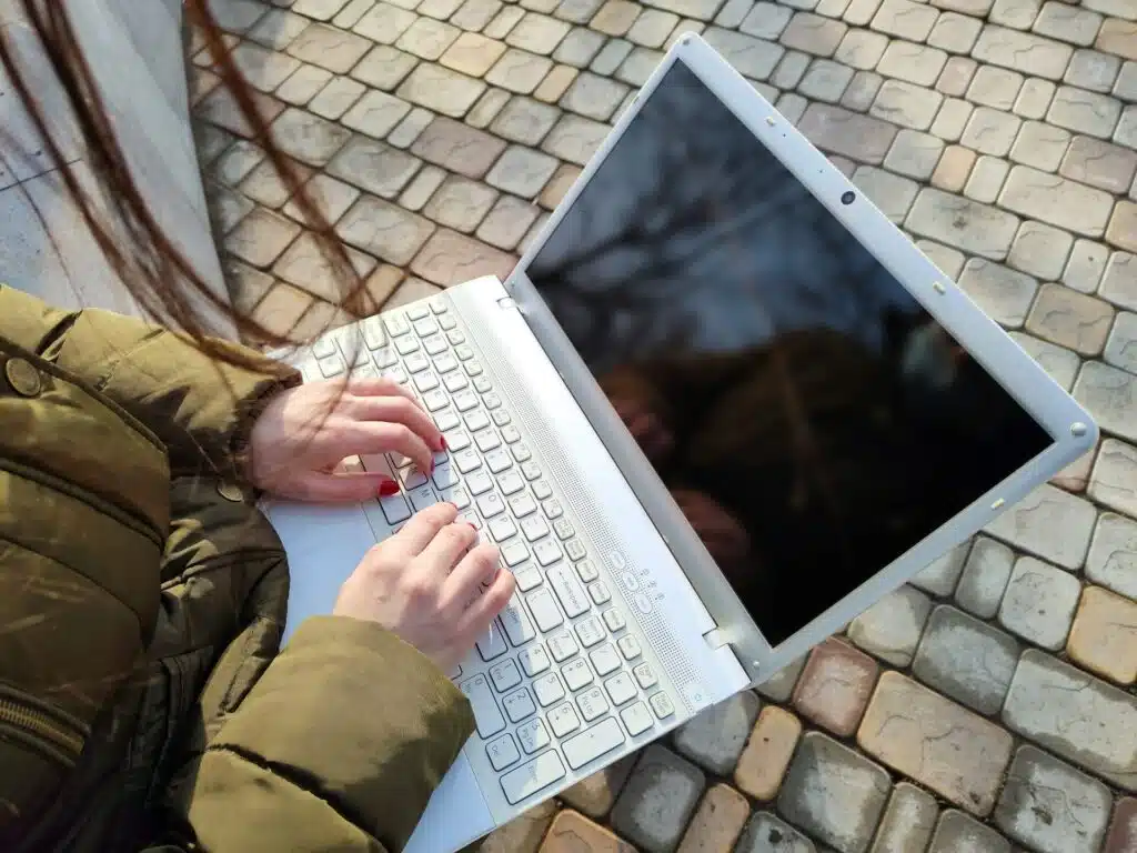 User researching Bitcoin casino reviews on a laptop
